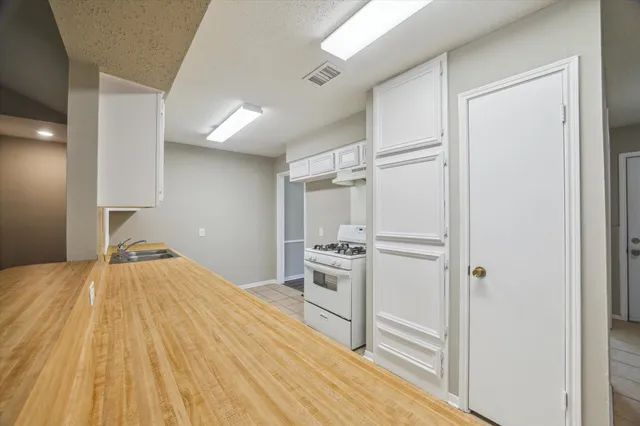 a room with a bed and a view of closet