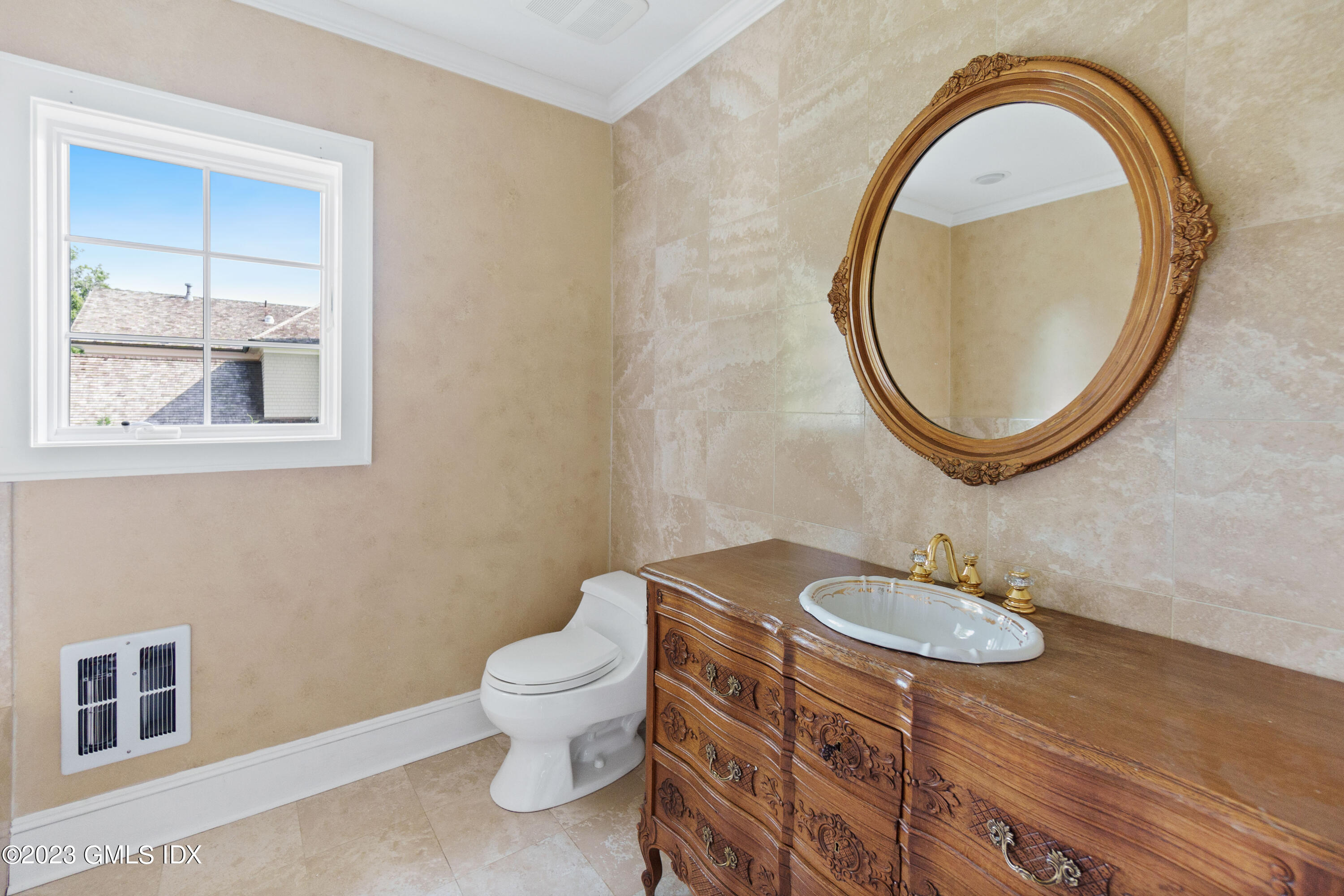20 Center Road Old Greenwich, CT 06870 - Photo 27 of 35 a bathroom with a sink a toilet and a mirror