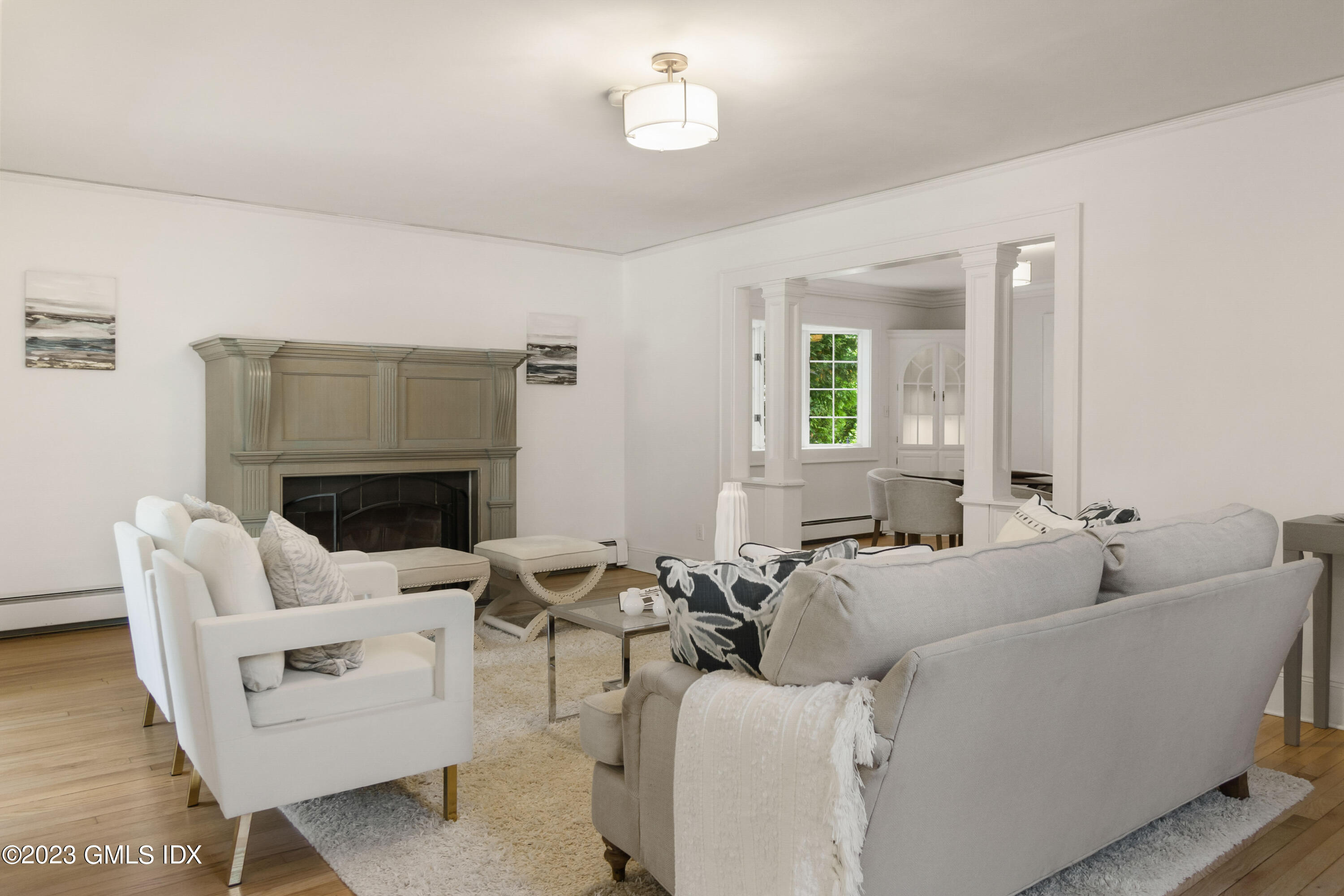 20 Center Road Old Greenwich, CT 06870 - Photo 5 of 35 a living room with furniture a fireplace and a table