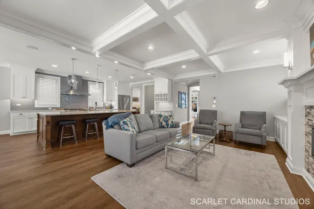 a living room with furniture and kitchen view