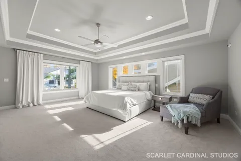 a bedroom with a bed couch and window