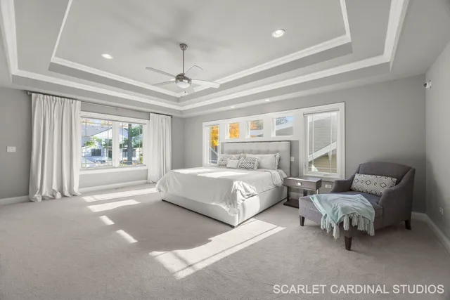 a bedroom with a bed couch and window