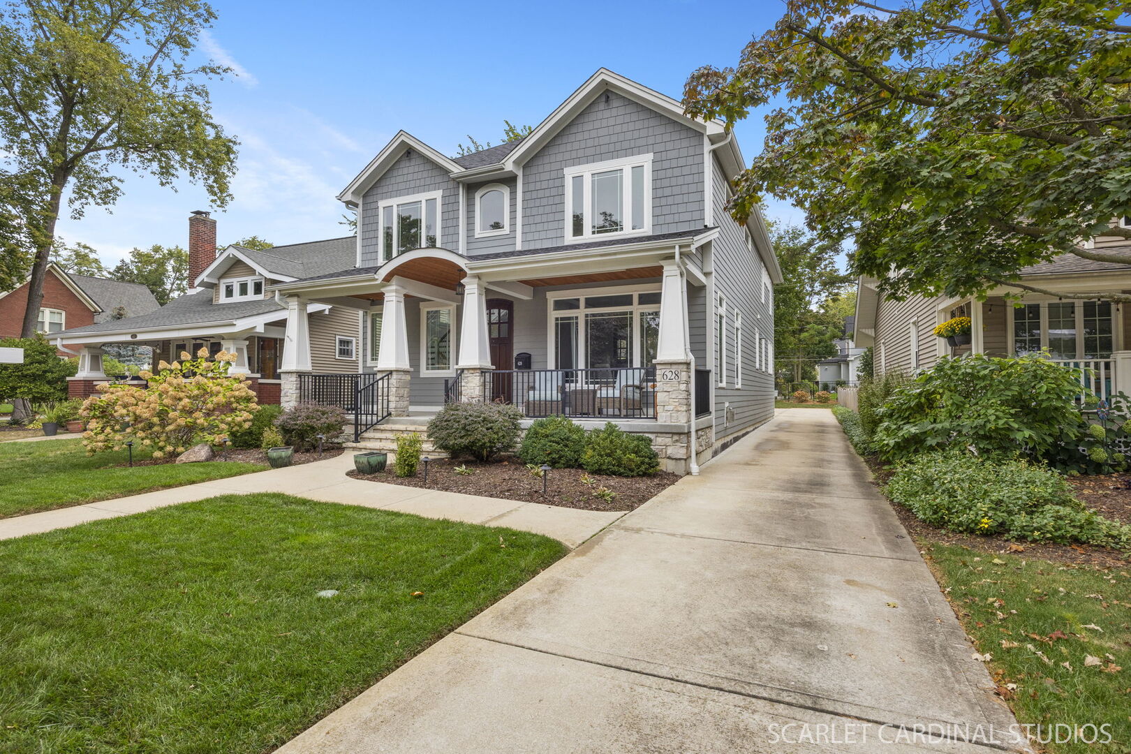 628 North Brainard Street Naperville, IL 60563 - Photo 3 of 8 a front view of a house with a yard