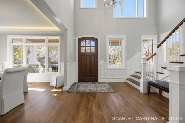 a view of an entryway with wooden floor and windows