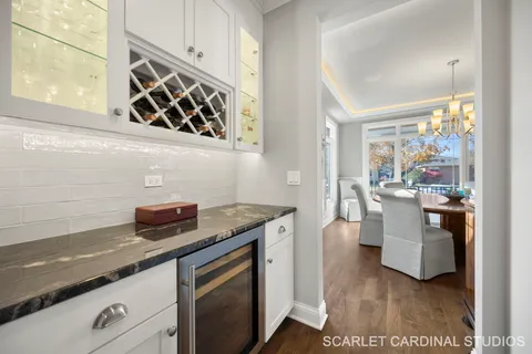 a kitchen with granite countertop a sink and a stove