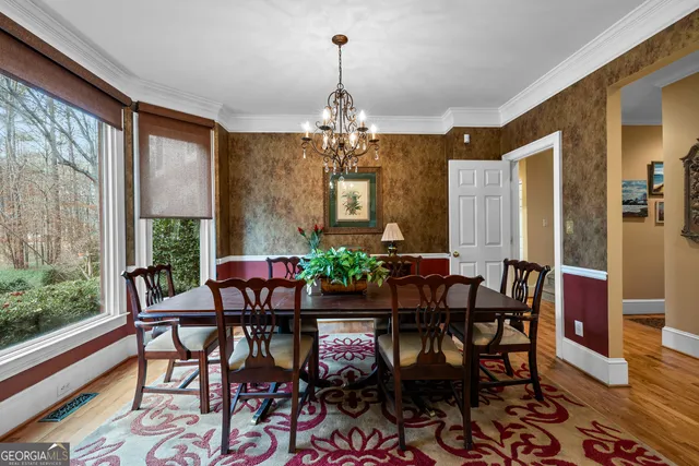 a kitchen with stainless steel appliances granite countertop a sink counter space cabinets and a window