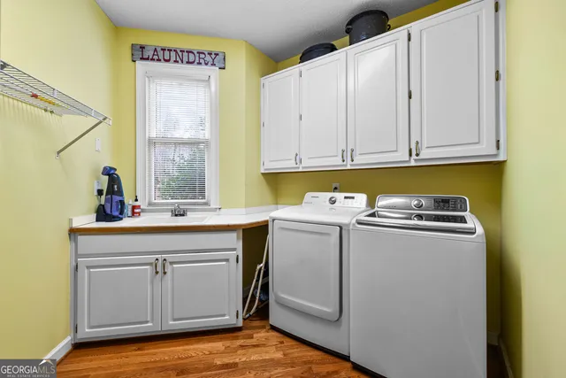 a spacious bathroom with a granite countertop sink and a mirror