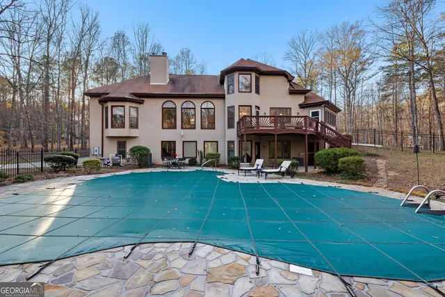 a bathroom with a toilet and a shower curtain