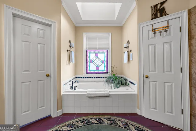 a bedroom with a bed and a dresser in it