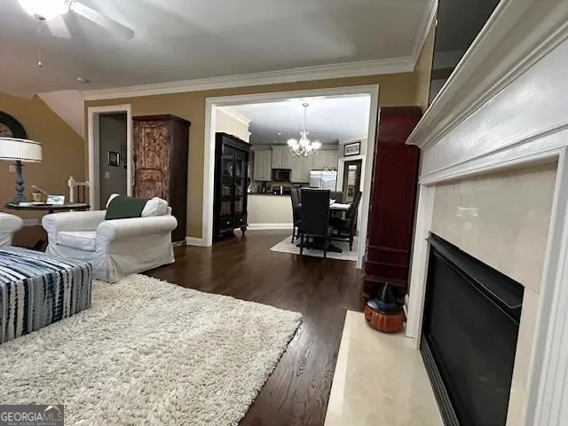 a kitchen with a dining table chairs stainless steel appliances and cabinets