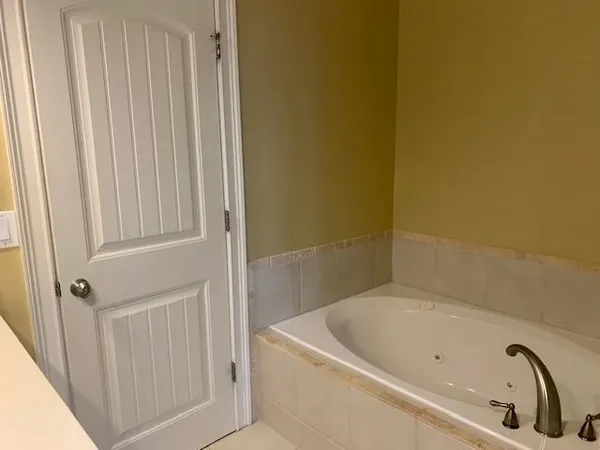 a bathroom with 2 sink and a mirror