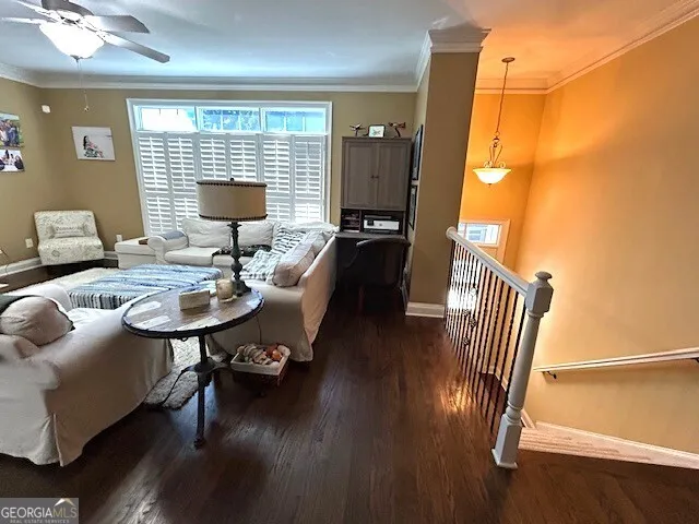 a view of a kitchen with a stove cabinets and a ceiling fan