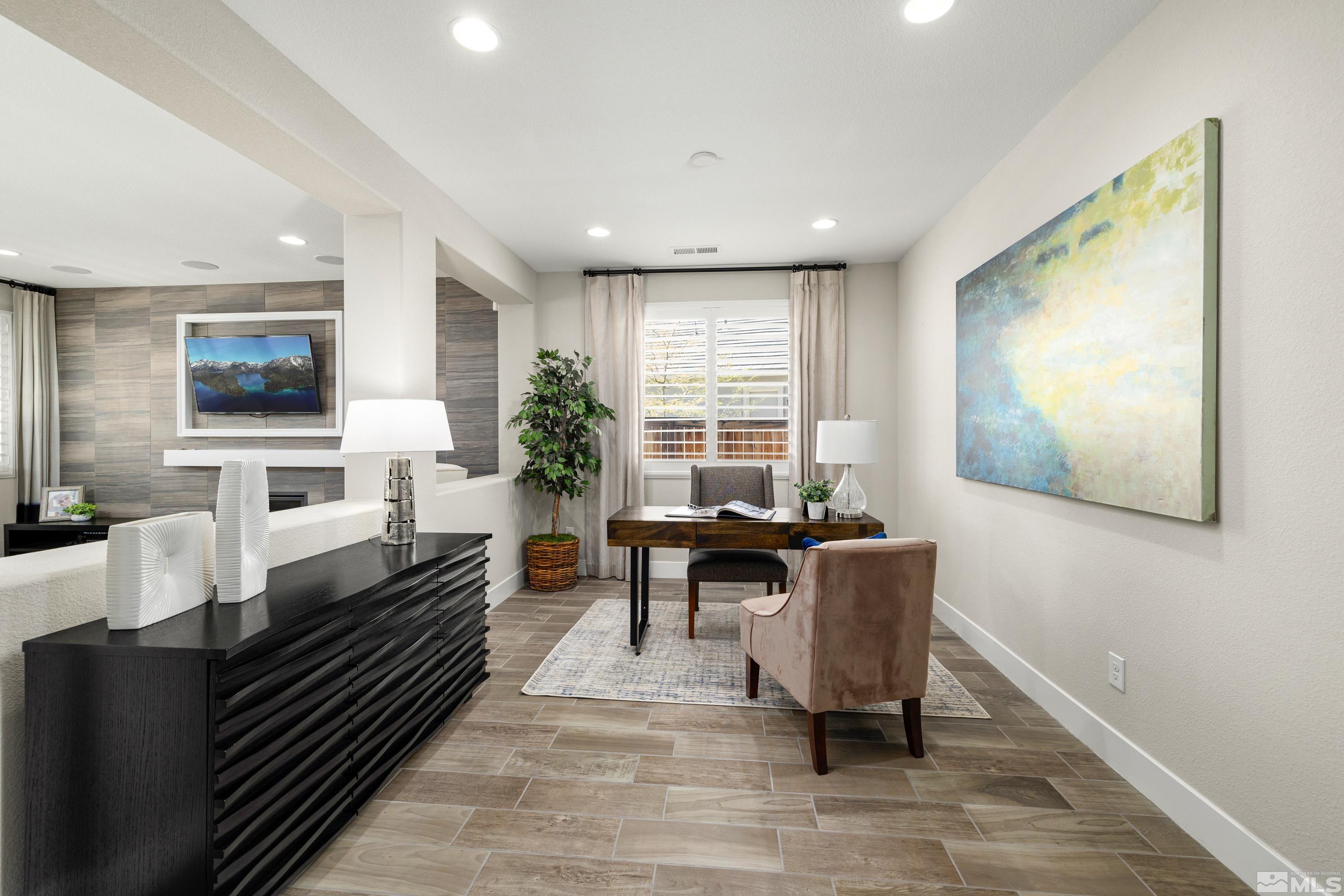 9940 Bernborough Drive Reno, NV 89521 - Photo 11 of 40 a living room with furniture and a flat screen tv