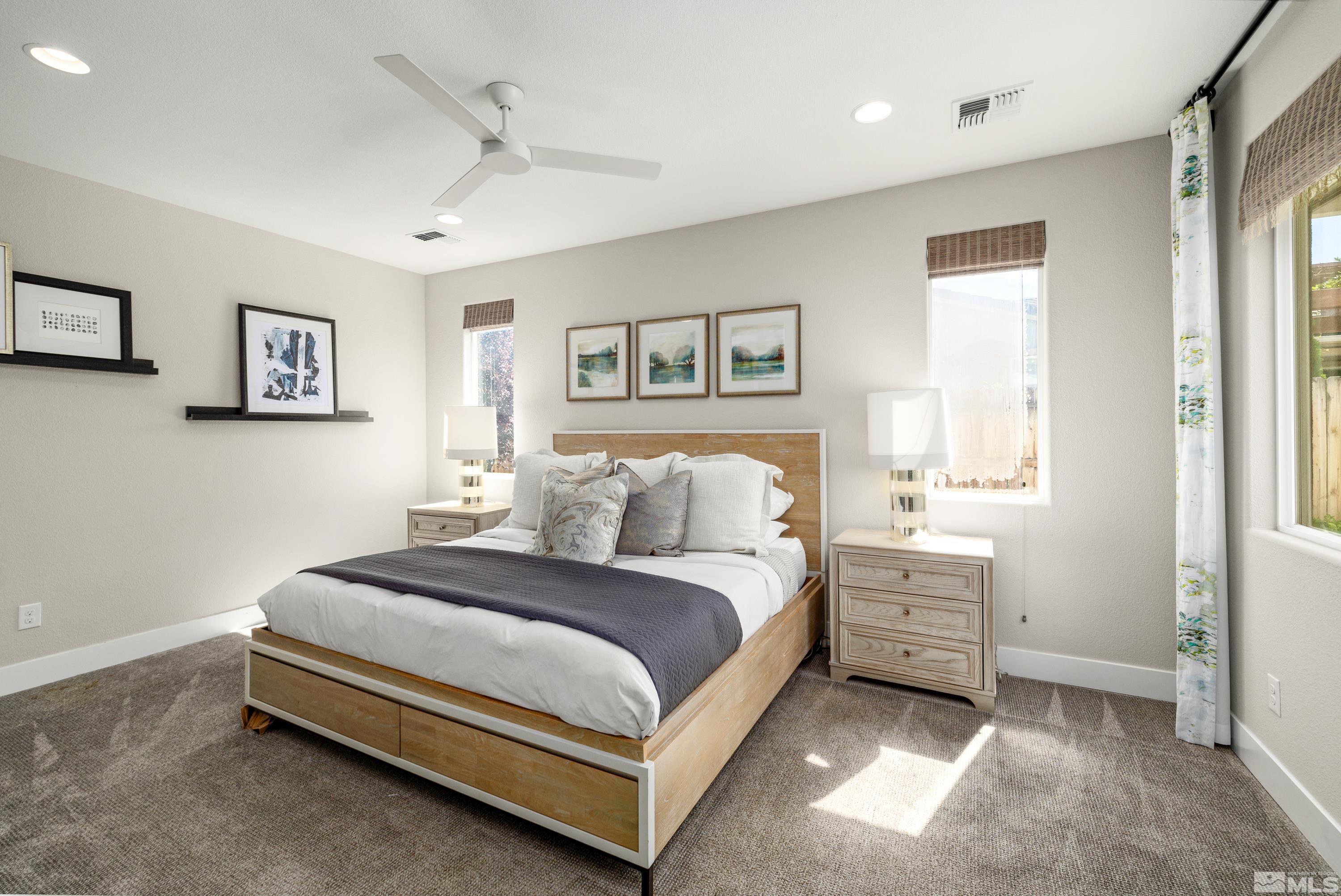 9940 Bernborough Drive Reno, NV 89521 - Photo 12 of 40 a spacious bedroom with a bed and a window