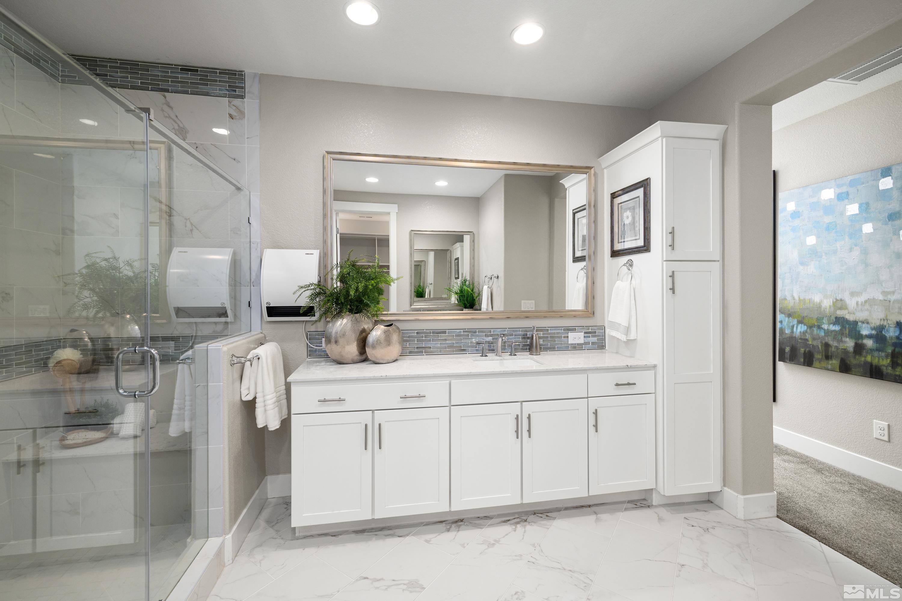 9940 Bernborough Drive Reno, NV 89521 - Photo 15 of 40 a bathroom with a granite countertop sink mirror and bathtub