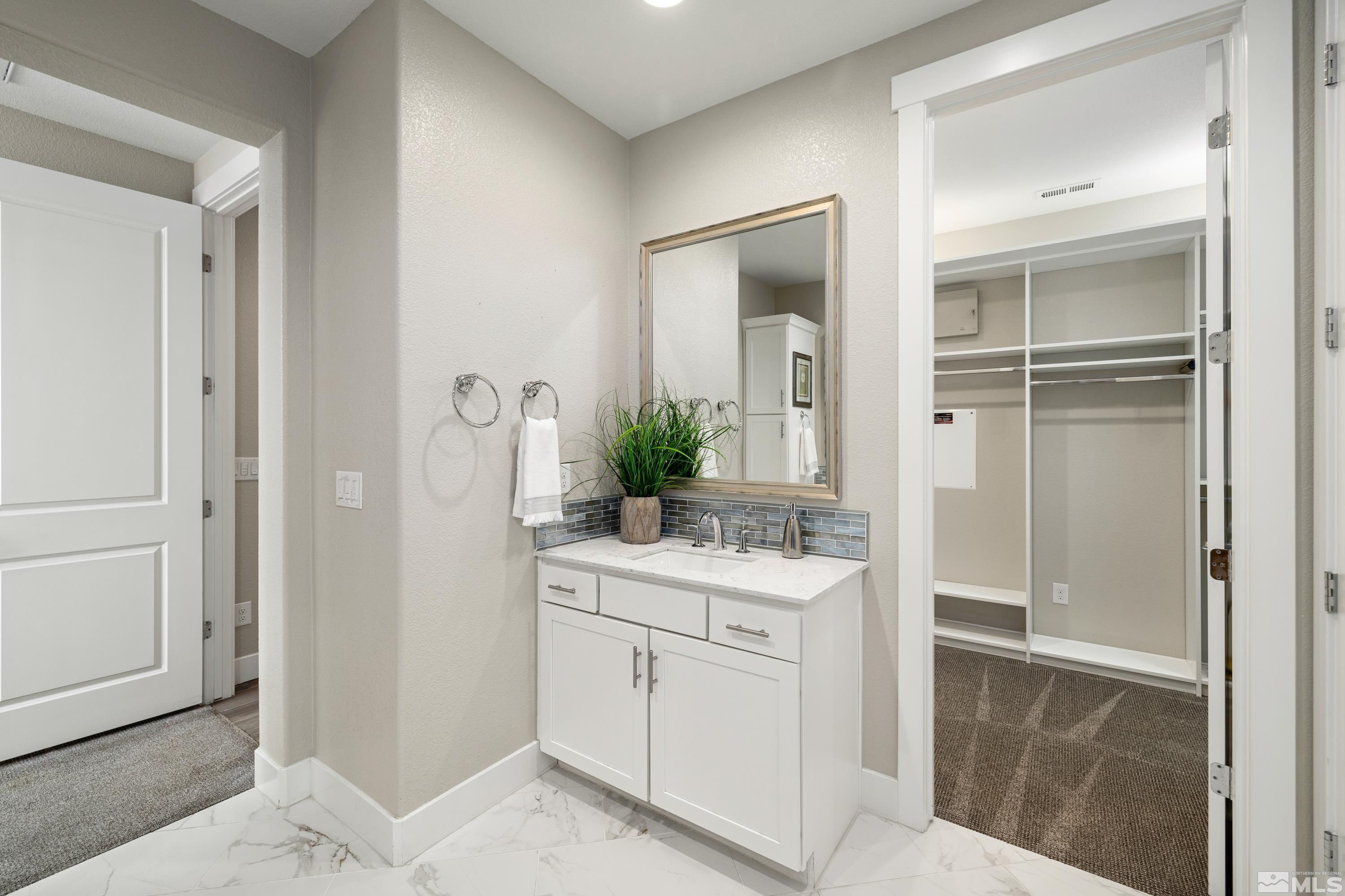 9940 Bernborough Drive Reno, NV 89521 - Photo 16 of 40 a room with a sink and a mirror