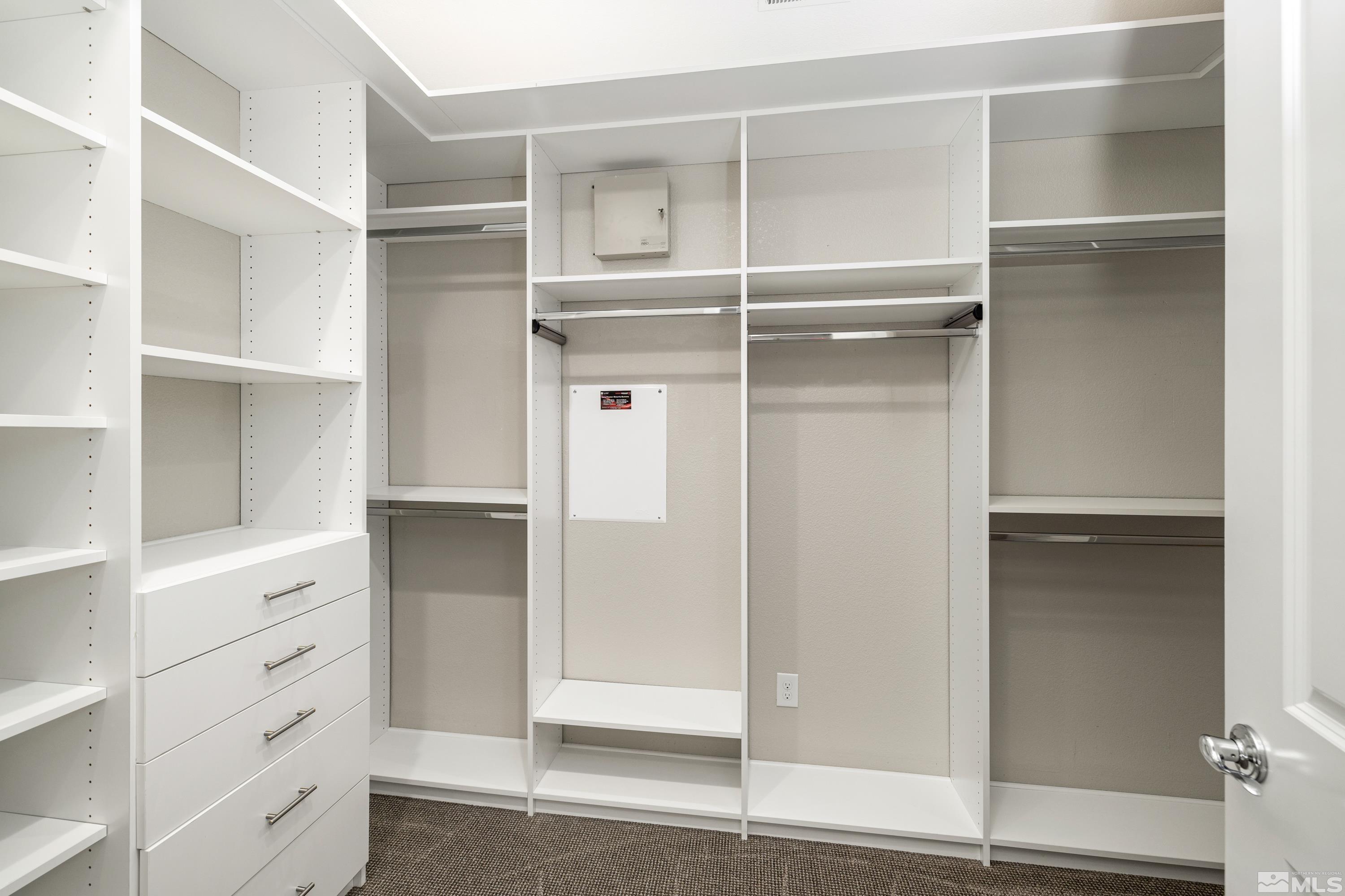 9940 Bernborough Drive Reno, NV 89521 - Photo 17 of 40 a view of walk in closet with empty racks