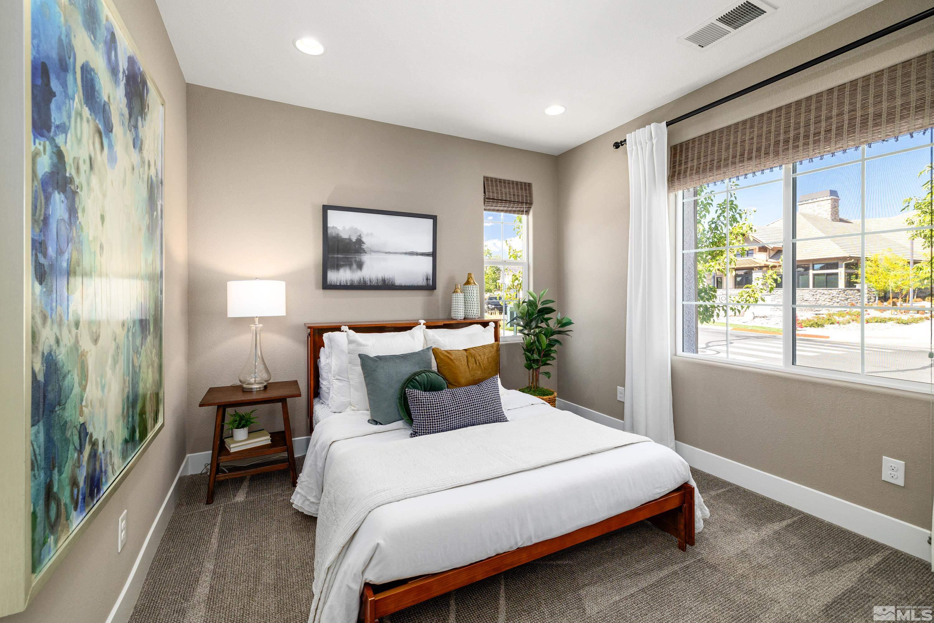 9940 Bernborough Drive Reno, NV 89521 - Photo 18 of 40 a bedroom with a large bed and a window