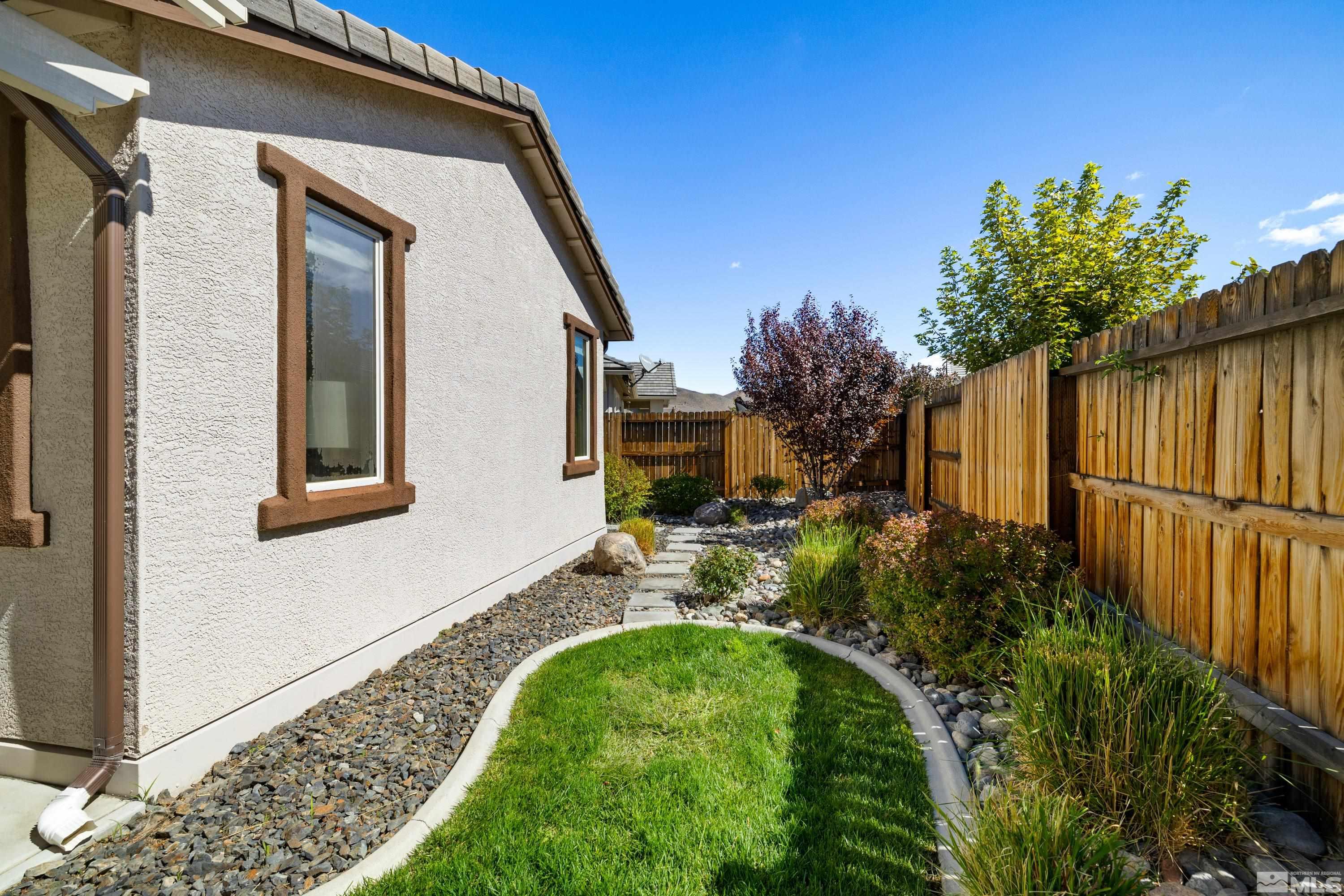 9940 Bernborough Drive Reno, NV 89521 - Photo 24 of 40 a house with trees in front of it