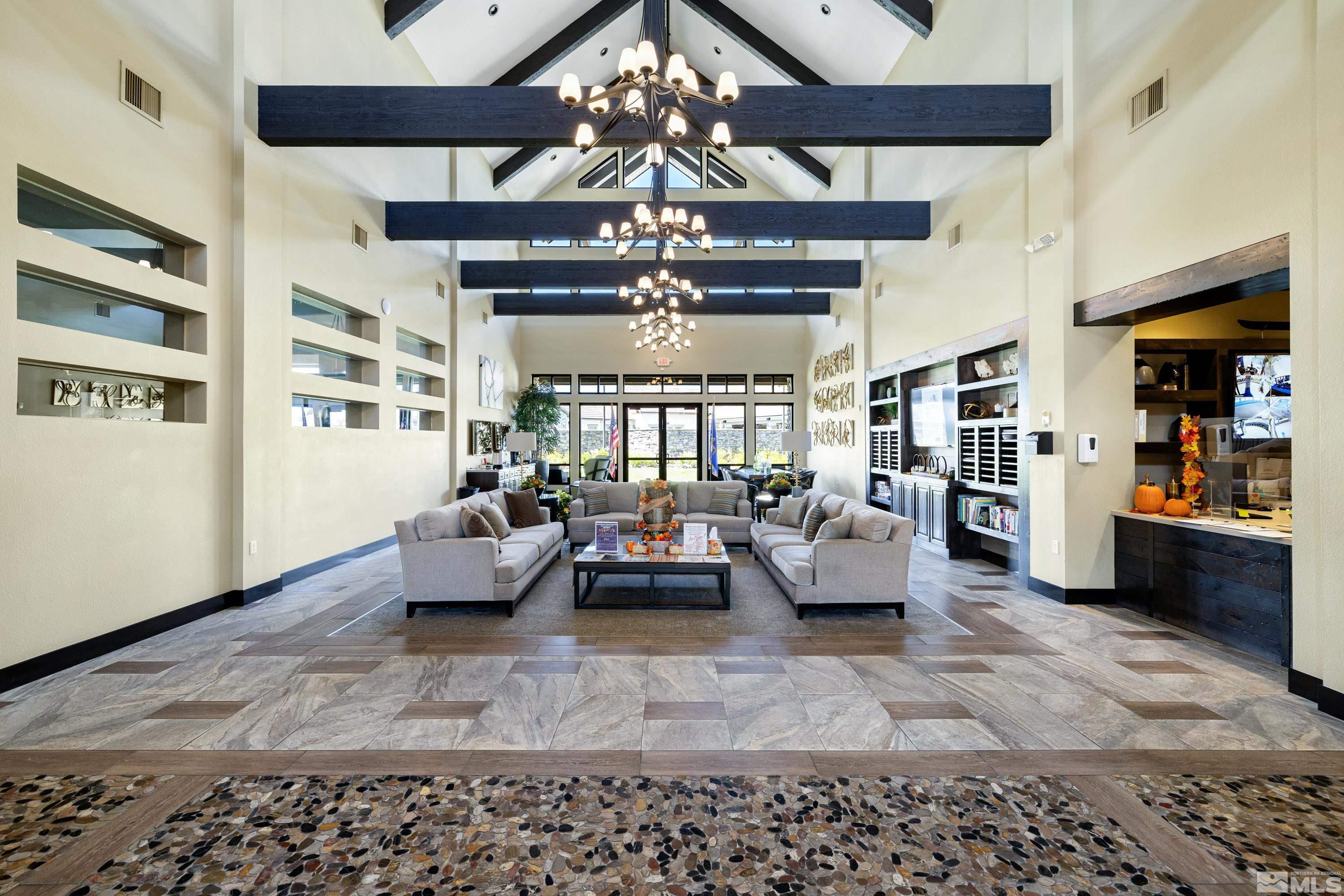 9940 Bernborough Drive Reno, NV 89521 - Photo 27 of 40 a living room with furniture or chandelier and a rug