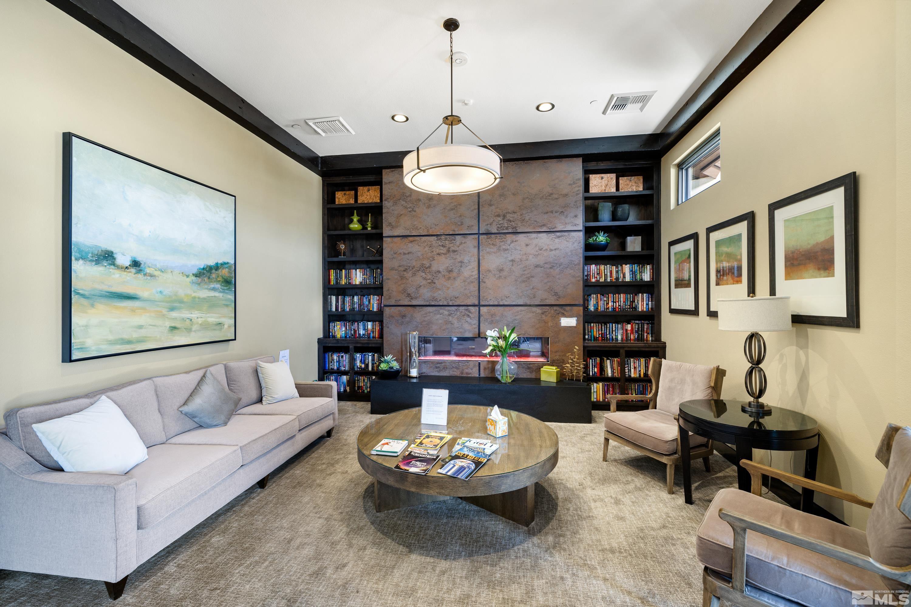9940 Bernborough Drive Reno, NV 89521 - Photo 28 of 40 a living room with furniture and a chandelier