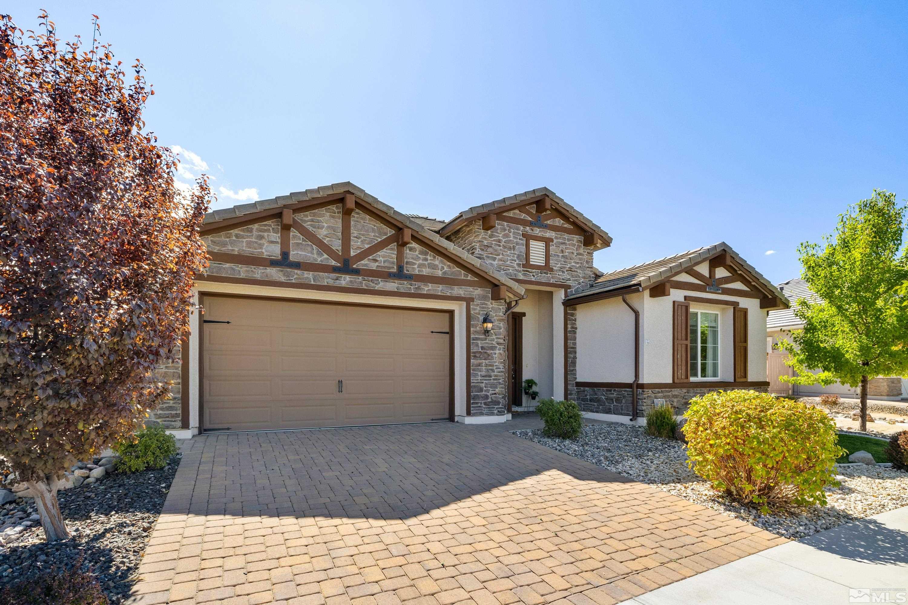 9940 Bernborough Drive Reno, NV 89521 - Photo 39 of 40 a front view of a house with a yard and garage