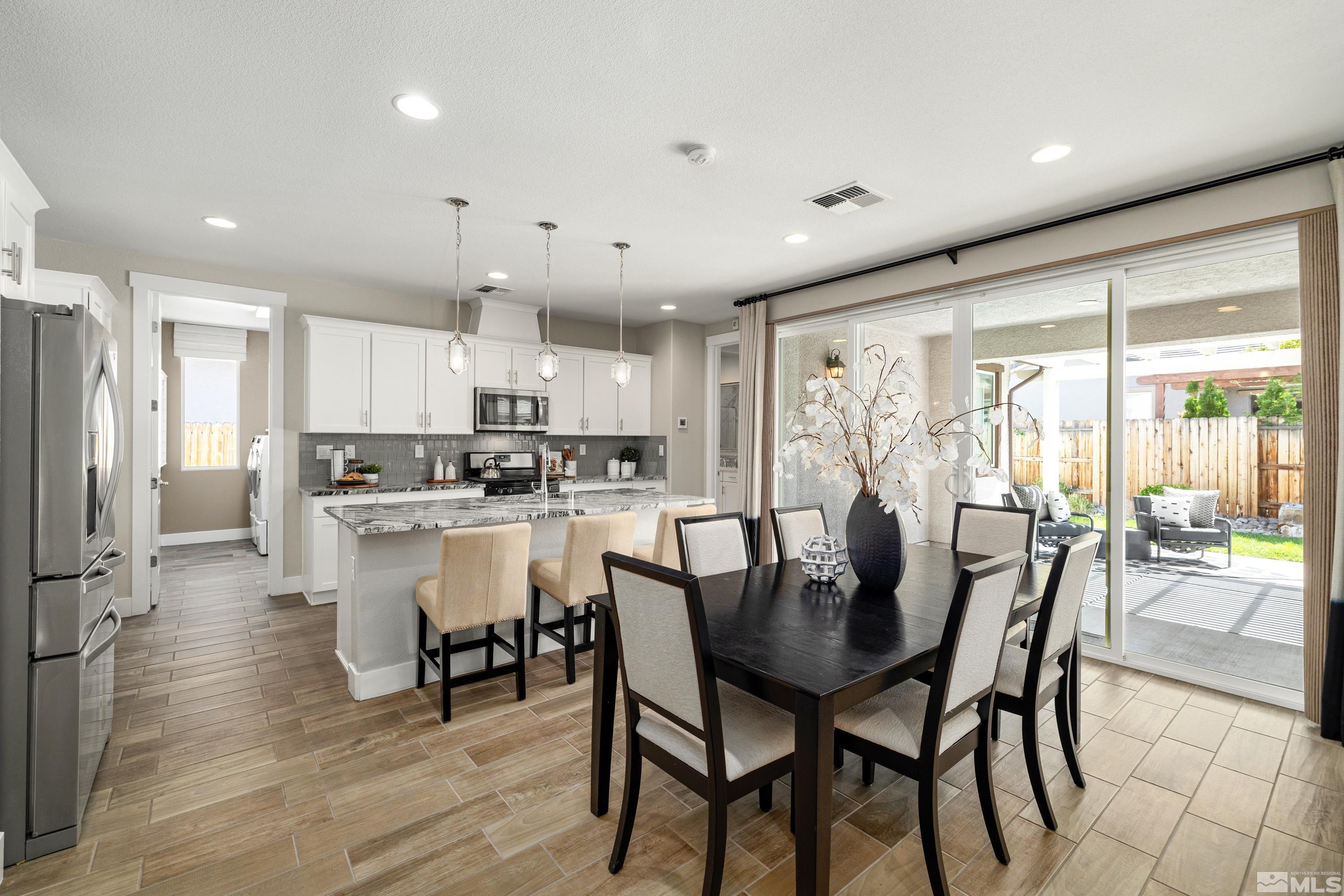 9940 Bernborough Drive Reno, NV 89521 - Photo 9 of 40 a view of a dining room with furniture and wooden floor