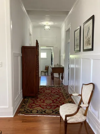 a view of a room with wooden floor and stairs
