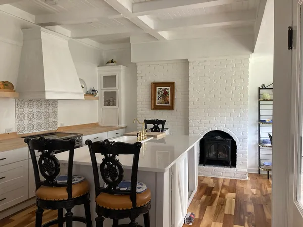 a kitchen with a stove and cabinets