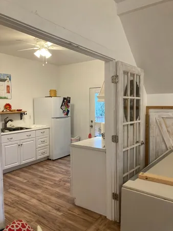 a bedroom with furniture and wooden floor