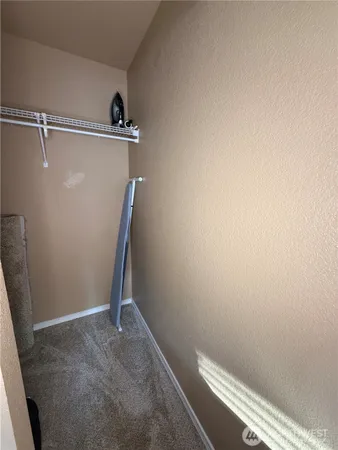 a room with water heater and a table