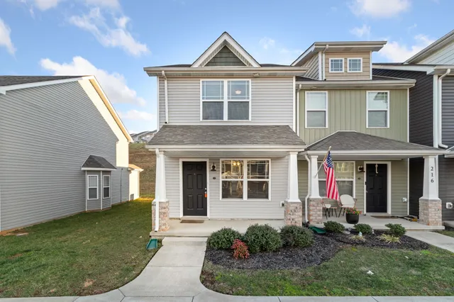 a front view of a house with garden
