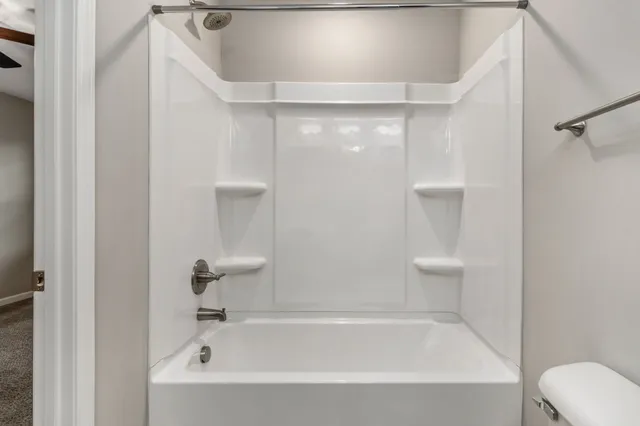 a bathroom with a shower and bathtub