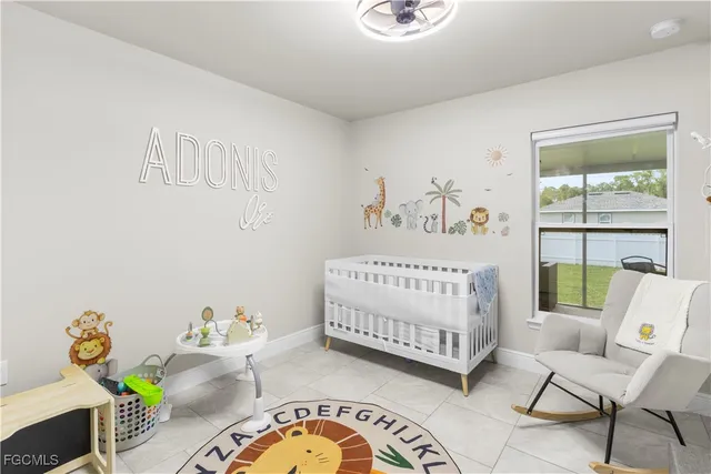 a bedroom with furniture and a wooden floor