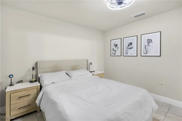 a bedroom with a bed and a desk