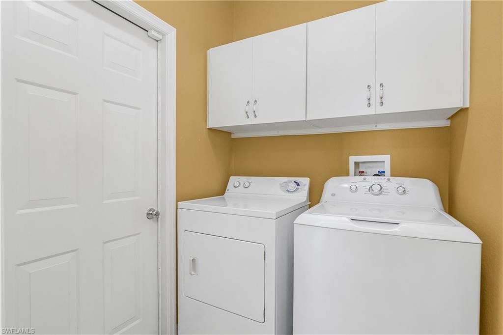 7820 Sandpine Court, Unit 2304 Naples, FL 34104 - Photo 28 of 50 a utility room with dryer and washer