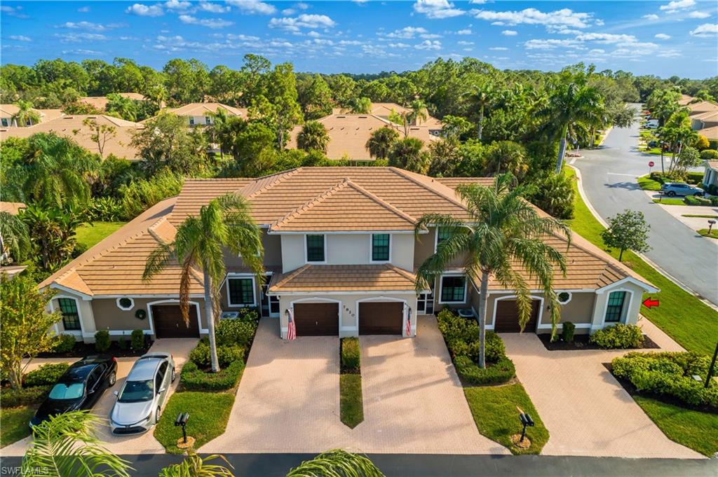 7820 Sandpine Court, Unit 2304 Naples, FL 34104 - Photo 35 of 50 an aerial view of a house with a yard