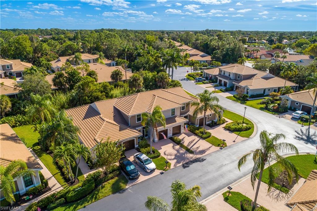7820 Sandpine Court, Unit 2304 Naples, FL 34104 - Photo 37 of 50 an aerial view of residential houses with outdoor space