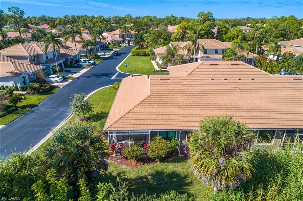7820 Sandpine Court, Unit 2304 Naples, FL 34104 - Photo 39 of 50 an aerial view of a house with a yard
