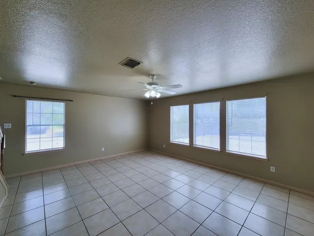 a view of an empty room and window