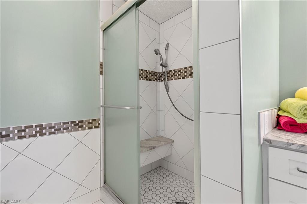 48 Oceans Boulevard, Unit 48 Naples, FL 34104 - Photo 17 of 26 a view of a storage & utility room with racks on the wall