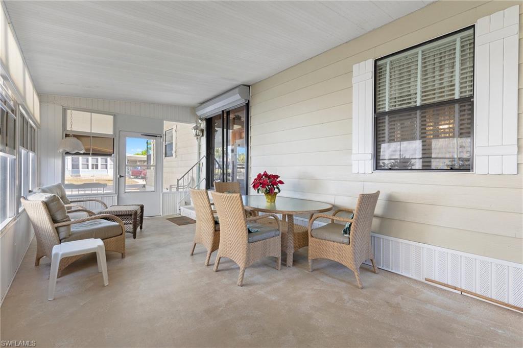 48 Oceans Boulevard, Unit 48 Naples, FL 34104 - Photo 22 of 26 a view of a dining room with furniture window and outside view