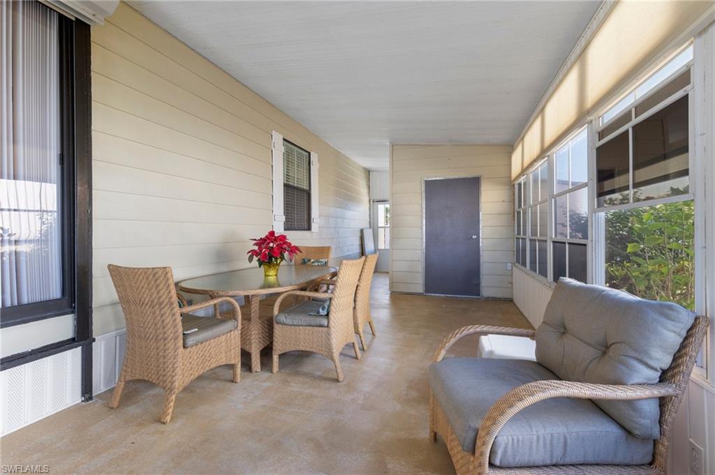 48 Oceans Boulevard, Unit 48 Naples, FL 34104 - Photo 23 of 26 a dining room with furniture and window