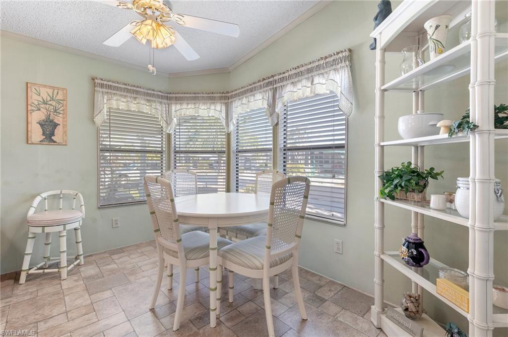 48 Oceans Boulevard, Unit 48 Naples, FL 34104 - Photo 6 of 26 a dining room with furniture and window