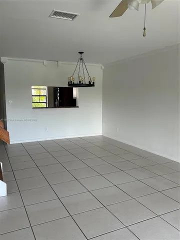 a view of a air conditioner and an empty room