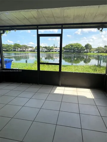 a view of swimming pool from a balcony
