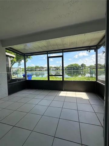 a view of an empty room with a large window