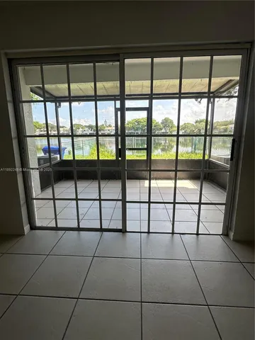 a view of a empty room and window