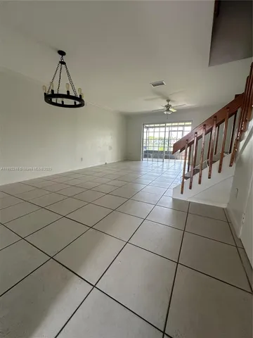 a view of a livingroom with stairs