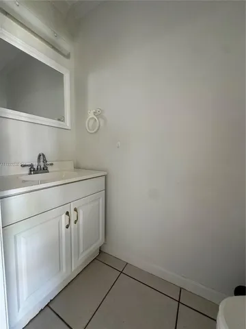 a utility room with sink dryer and washer